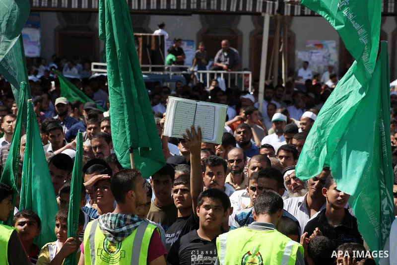 Palestinians hold placards as they shout anti-U.S. slogans during a demonstration against the controversial film 'Innocence of Muslims' in Khan Younis southern Gaza strip, on September 14, 2012. The controversial low bud...
