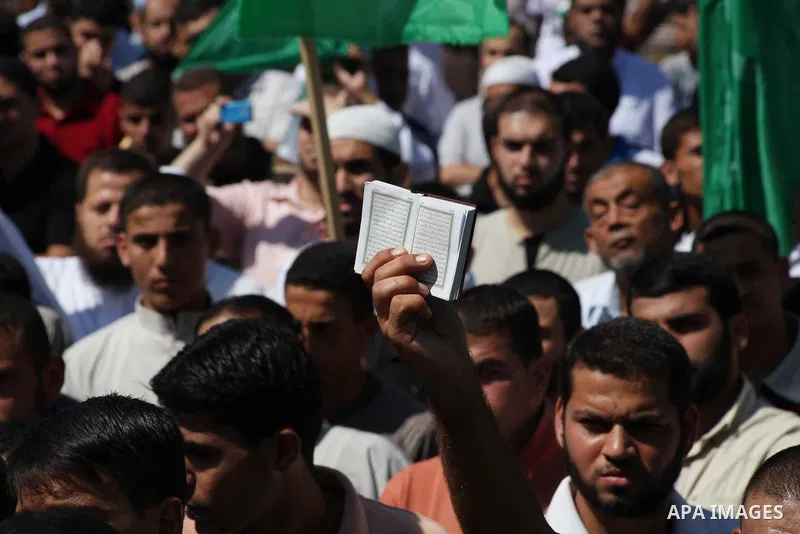 Palestinians hold placards as they shout anti-U.S. slogans during a demonstration against the controversial film 'Innocence of Muslims' in Khan Younis southern Gaza strip, on September 14, 2012. The controversial low bud...