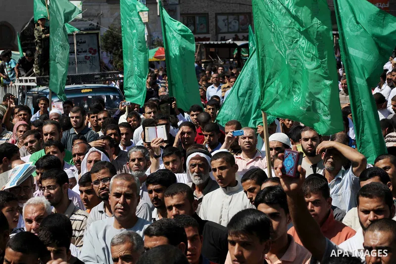 Palestinians hold placards as they shout anti-U.S. slogans during a demonstration against the controversial film 'Innocence of Muslims' in Khan Younis southern Gaza strip, on September 14, 2012. The controversial low bud...