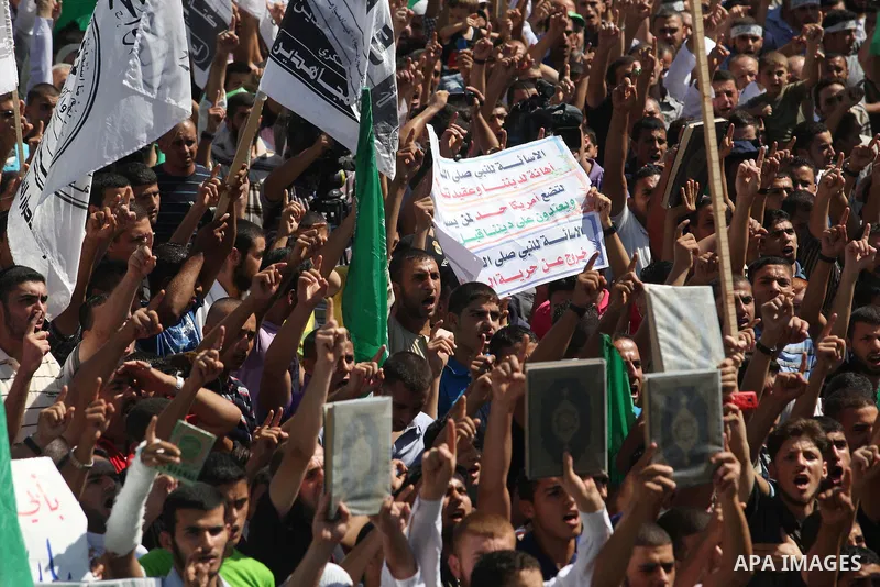 Palestinians shout anti-U.S. slogans during a demonstration against the controversial film 'Innocence of Muslims' in Gaza City, on September 14, 2012. The controversial low budget film reportedly made by an Israeli-Ameri...