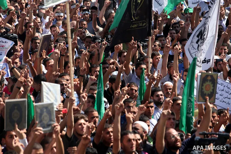 Palestinians shout anti-U.S. slogans during a demonstration against the controversial film 'Innocence of Muslims' in Gaza City, on September 14, 2012. The controversial low budget film reportedly made by an Israeli-Ameri...