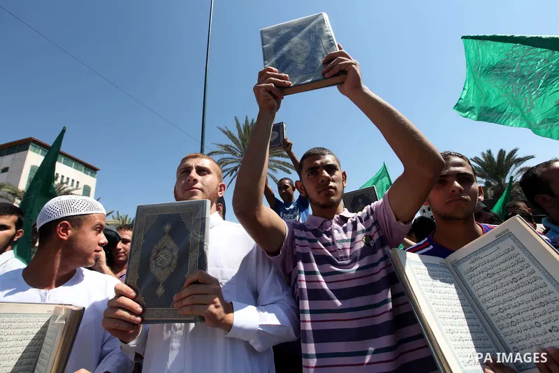 Palestinians shout anti-U.S. slogans during a demonstration against the controversial film 'Innocence of Muslims' in Gaza City, on September 14, 2012. The controversial low budget film reportedly made by an Israeli-Ameri...