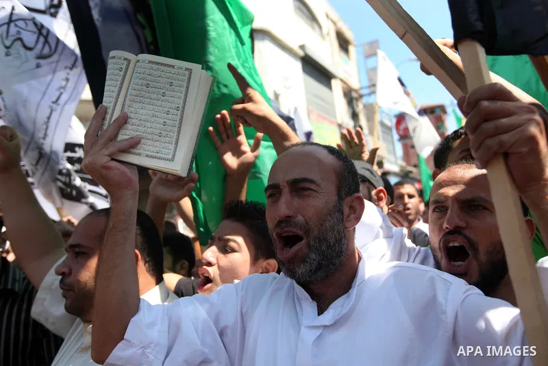 Palestinians shout anti-U.S. slogans during a demonstration against the controversial film 'Innocence of Muslims' in Gaza City, on September 14, 2012. The controversial low budget film reportedly made by an Israeli-Ameri...