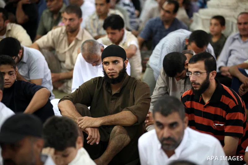 Palestinians attend Friday prayers in al-Omari Mosque before a demonstration against the controversial film 'Innocence of Muslims' in Gaza city, on September 14, 2012. The controversial low budget film reportedly made by...