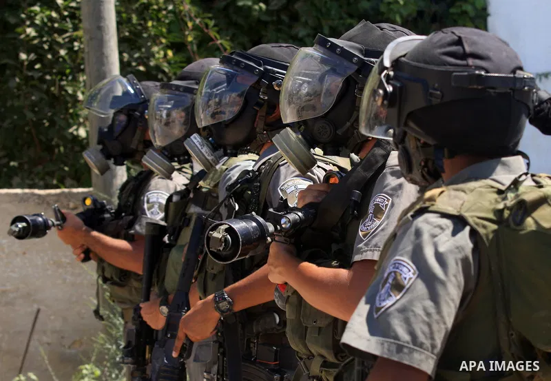 Israeli border police stand guards during a demonstration against the expropriation of Palestinian land by Israel in the village of Kafr Qaddum, near the West Bank city of Nablus, on Sept. 14, 2012. Photo by Nedal Eshtay...