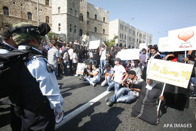 Israeli policemen repress a demonstration against the controversial film 'Innocence of Muslims' in front of al-Aqsa Mosqe in Jerusalem, on September 14, 2012. The controversial low budget film reportedly made by an Israe...