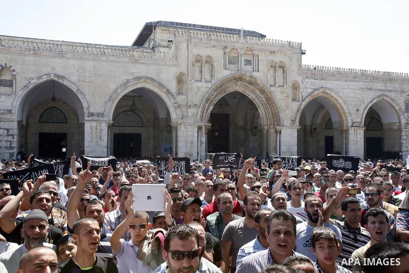 Palestinians shout slogans during a demonstration against the controversial film 'Innocence of Muslims' in front of al-Aqsa Mosqe in Jerusalem, on September 14, 2012. The controversial low budget film reportedly made by...