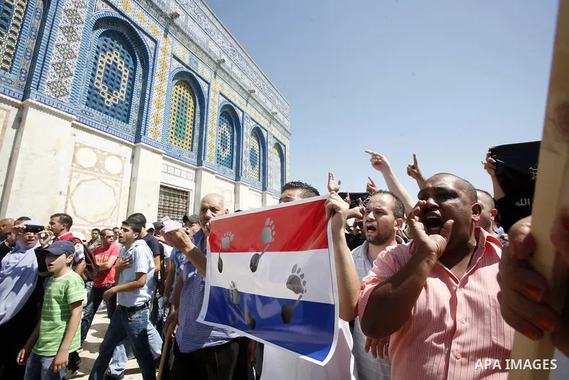 Palestinians shout slogans during a demonstration against the controversial film 'Innocence of Muslims' in front of al-Aqsa Mosqe in Jerusalem, on September 14, 2012. The controversial low budget film reportedly made by...