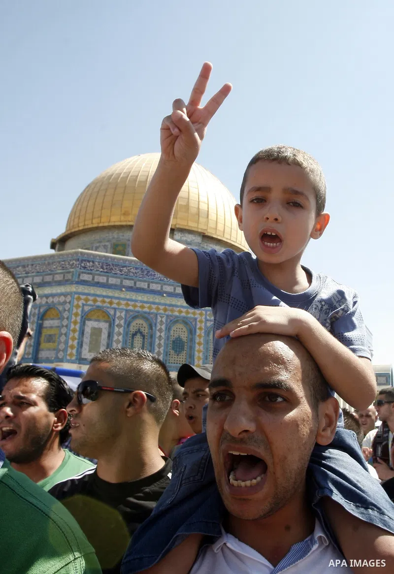 Palestinians shout slogans during a demonstration against the controversial film 'Innocence of Muslims' in front of al-Aqsa Mosqe in Jerusalem, on September 14, 2012. The controversial low budget film reportedly made by...