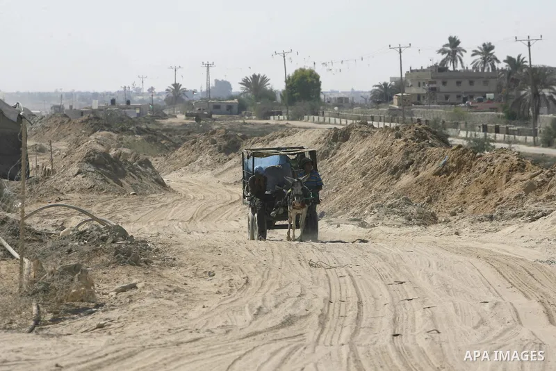 A Palestinian man rides his cart in front of smuggling tunnels along the Gaza-Egypt border in Rafah, in the southern Gaza Strip, on Sept. 15, 2012. The tunnels trade, which analysts estimate is worth half a billion dolla...
