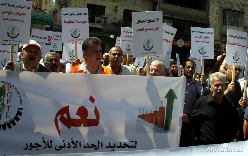 Palestinian protesters shout slogans during a demonstration against the high cost of living in the West Bank city of Nablus, Sept. 15, 2012. The Prime Minister pledged earlier that the Palestinian Authority will decrease...