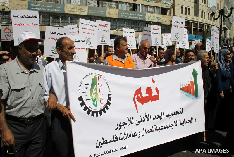 Palestinian protesters shout slogans during a demonstration against the high cost of living in the West Bank city of Nablus, Sept. 15, 2012. The Prime Minister pledged earlier that the Palestinian Authority will decrease...