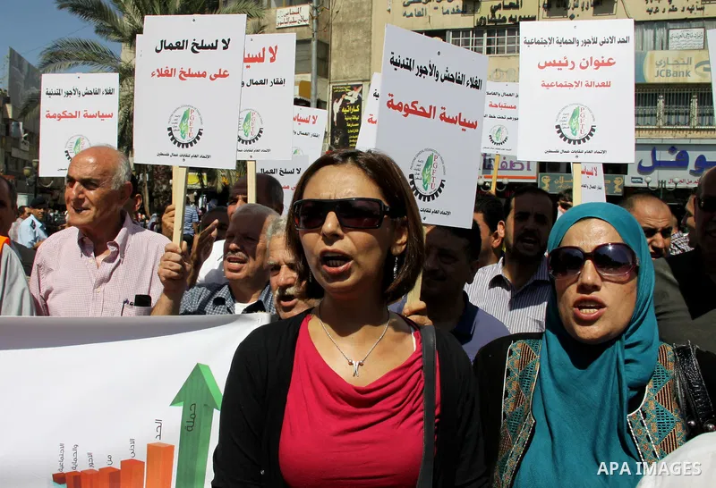 Palestinian protesters shout slogans during a demonstration against the high cost of living in the West Bank city of Nablus, Sept. 15, 2012. The Prime Minister pledged earlier that the Palestinian Authority will decrease...