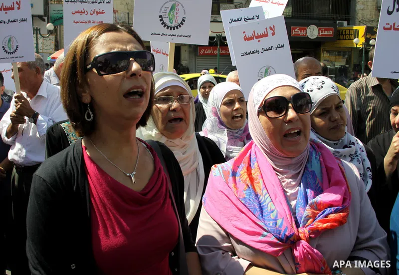 Palestinian protesters shout slogans during a demonstration against the high cost of living in the West Bank city of Nablus, Sept. 15, 2012. The Prime Minister pledged earlier that the Palestinian Authority will decrease...