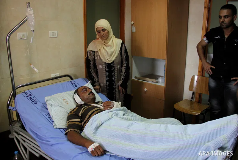 A palestinian Akram Bani Odeh "35" in Rafidia hospital, after he was attacked by Israeli settlers attack Palestinian farmers in the West Bank city of Nablus, on Sep. 16, 2012. Photo by Nedal Eshtayah
