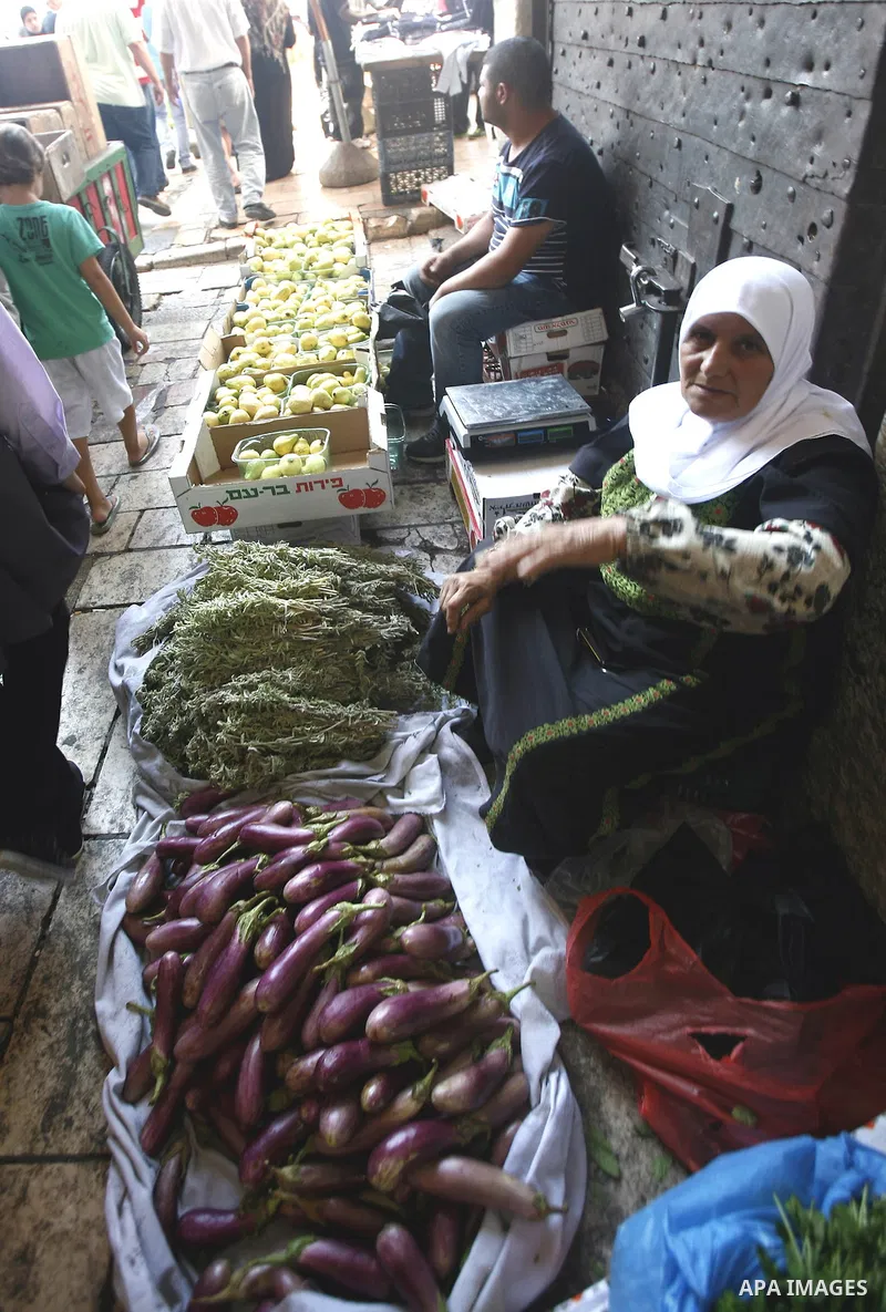 A Palestinian woman sells vegetables at the market of Jerusalem's old city on Sept. 16, 2012. Photo by Mahfouz Abu Turk
