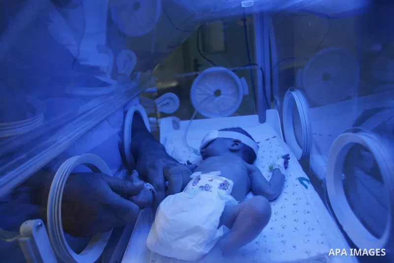 A nurse attends to a Palestinian infant in an incubator at Emirates Hospital in Rafah in Gaza Strip on Sep.17, 2012. Photo by Eyad Al Baba
