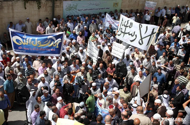 Hundreds of Palestinians hold a peaceful sit-in in the West Bank city of Ramallah on September 17, 2012 against an anti-Islam film that has sparked violent demonstrations in the Muslim world. The low-budget, US-produced...
