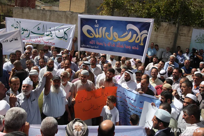 Hundreds of Palestinians hold a peaceful sit-in in the West Bank city of Ramallah on September 17, 2012 against an anti-Islam film that has sparked violent demonstrations in the Muslim world. The low-budget, US-produced...