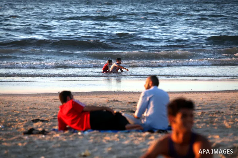 Palestinians enjoy a day at the beach of Gaza city, Sept 17, 2012. Photo by Majdi Fathi