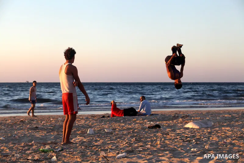 Palestinian youths play at the beach of Gaza city, Sept 17, 2012. Photo by Majdi Fathi