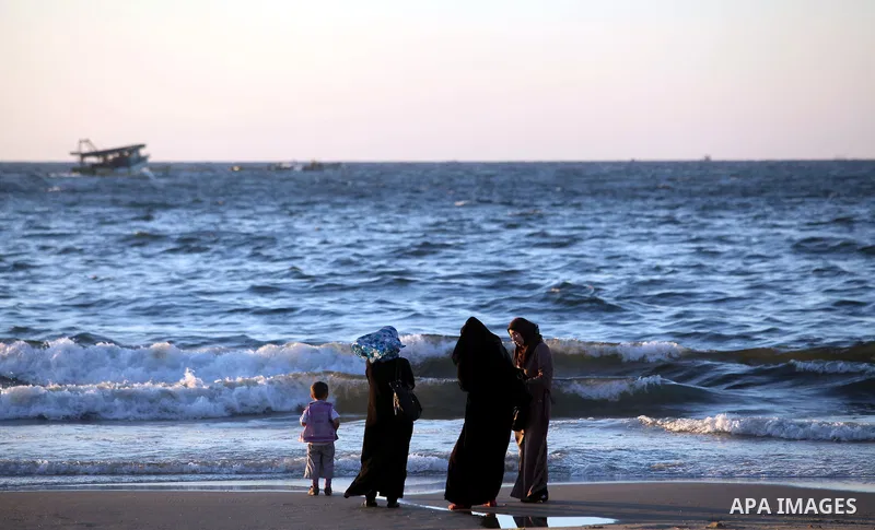 Palestinians enjoy a day at the beach of Gaza city, Sept 17, 2012. Photo by Majdi Fathi