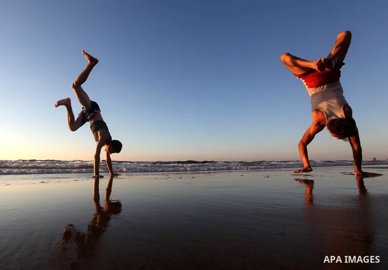 Palestinian youths play at the beach of Gaza city, Sept 17, 2012. Photo by Majdi Fathi