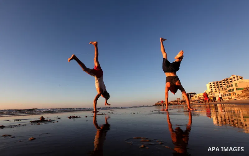 Palestinian youths play at the beach of Gaza city, Sept 17, 2012. Photo by Majdi Fathi