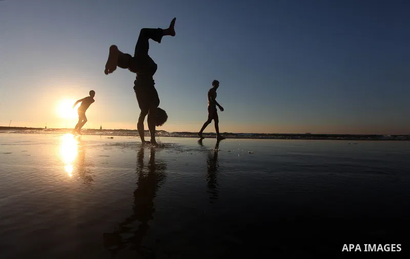 Palestinian youths play at the beach of Gaza city, Sept 17, 2012. Photo by Majdi Fathi