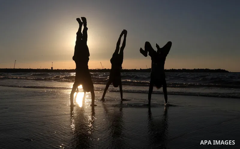 Palestinian youths play at the beach of Gaza city, Sept 17, 2012. Photo by Majdi Fathi