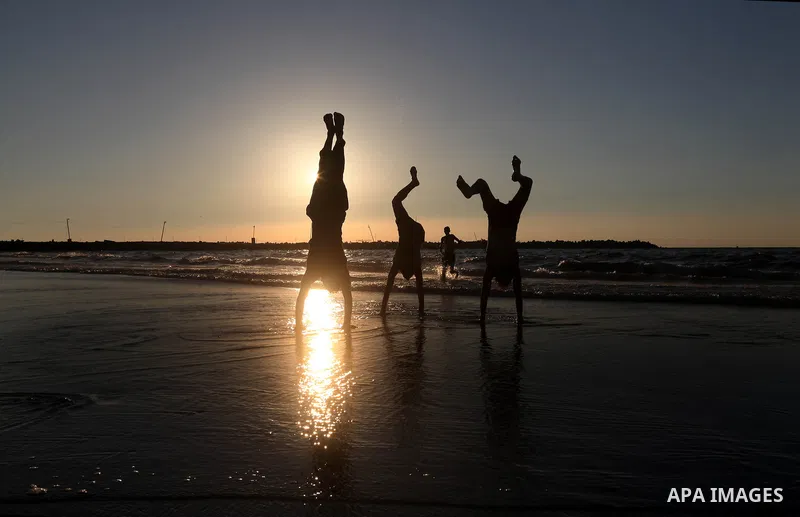 Palestinian youths play at the beach of Gaza city, Sept 17, 2012. Photo by Majdi Fathi