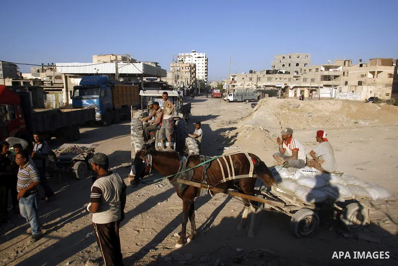 Palestinian tunnels workers stop working during a protest against the Egyptian decision to close the smuggling tunnels along the Gaza-Egypt border in Rafah, in the southern Gaza Strip, on Sept. 18, 2012. The tunnels trad...