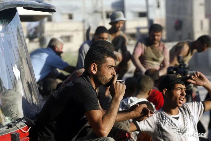 Palestinian tunnels workers stop working during a protest against the Egyptian decision to close the smuggling tunnels along the Gaza-Egypt border in Rafah, in the southern Gaza Strip, on Sept. 18, 2012. The tunnels trad...