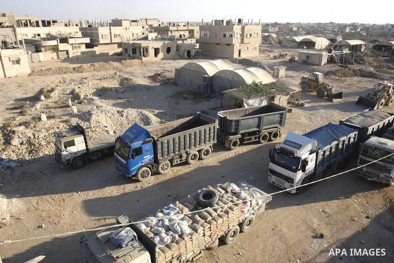 Lorries used to transfer goods from the smuggling tunnels stops working during a protest against the Egyptian decision to close the smuggling tunnels along the Gaza-Egypt border in Rafah, in the southern Gaza Strip, on S...