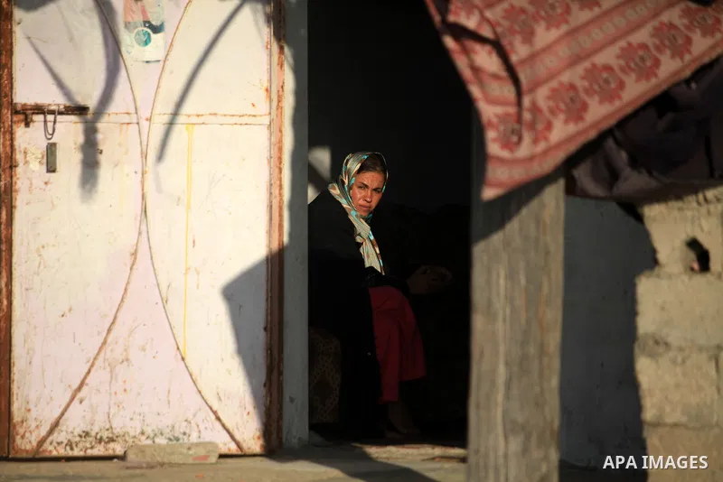 A Palestinian woman sits in front of her house in Deir al-Balah in the central of Gaza strip, Sept. 18, 2012 . Photo by Majdi Fathi