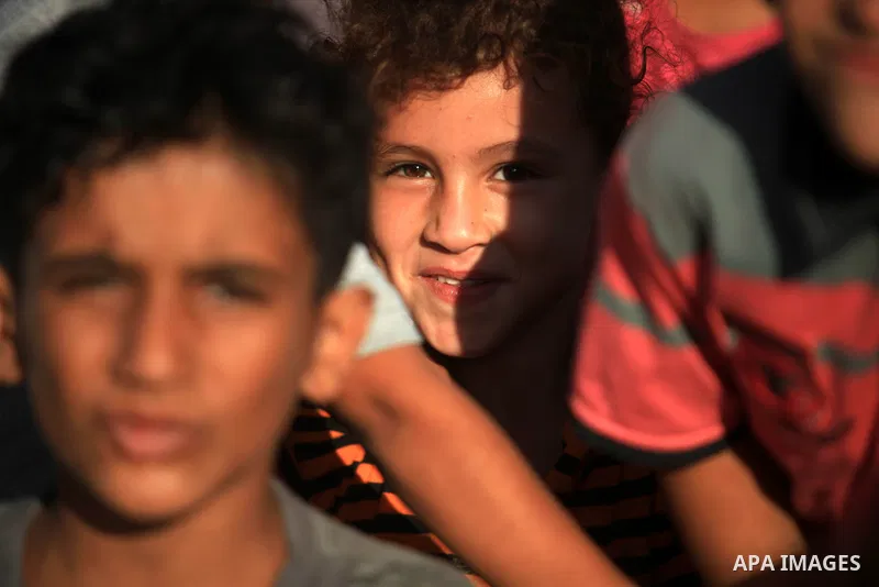 Palestinian children play in front of their house in Deir al-Balah in the central of Gaza strip, Sept. 18, 2012. Photo by Majdi Fathi