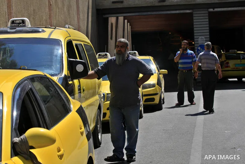 Palestinian taxi drivers stop their cars for 15 minutes during a solidarity with the Palestinian prisoners on hunger strike in Israeli jails, in the West Bank city of Nablus, on Sept. 20, 2012. Photo by Nedal Eshtayah