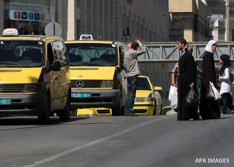 Palestinian taxi drivers stop their cars for 15 minutes during a solidarity with the Palestinian prisoners on hunger strike in Israeli jails, in the West Bank city of Nablus, on Sept. 20, 2012. Photo by Nedal Eshtayah