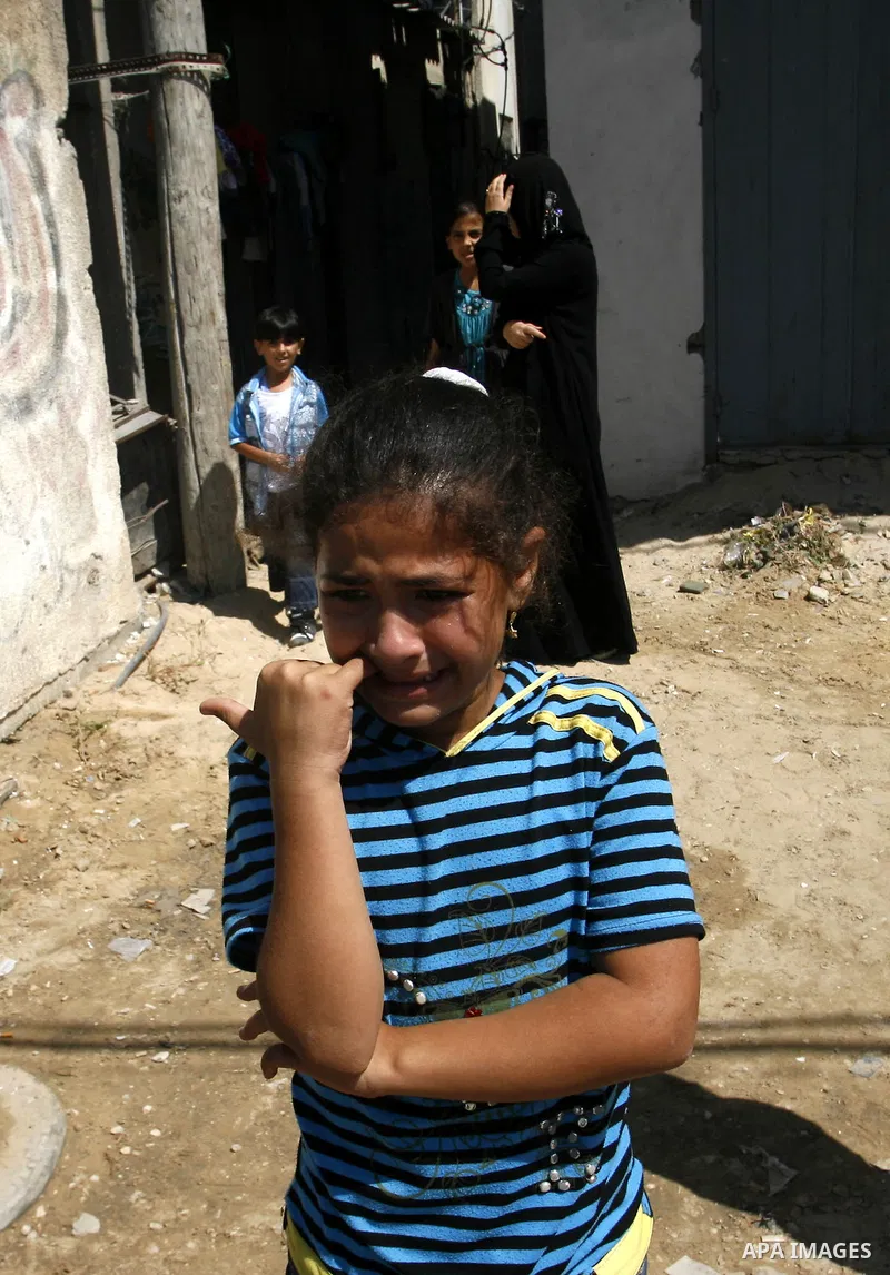 Palestinian relatives of Ibrahim Abu Enein mourn during his funeral in Rafah, southern Gaza Strip, on September 20, 2012. An Israeli air strike on the Gaza Strip killed two Palestinians and wounded one late on September...