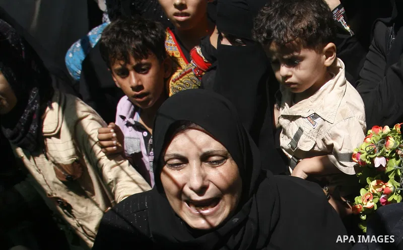 Palestinian relatives of Ibrahim Abu Enein mourn during his funeral in Rafah, southern Gaza Strip, on September 20, 2012. An Israeli air strike on the Gaza Strip killed two Palestinians and wounded one late on September...