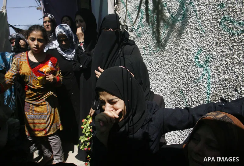 Palestinian relatives of Ibrahim Abu Enein mourn during his funeral in Rafah, southern Gaza Strip, on September 20, 2012. An Israeli air strike on the Gaza Strip killed two Palestinians and wounded one late on September...
