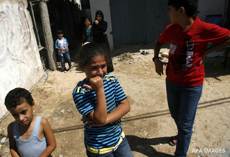 Palestinian relatives of Ibrahim Abu Enein mourn during his funeral in Rafah, southern Gaza Strip, on September 20, 2012. An Israeli air strike on the Gaza Strip killed two Palestinians and wounded one late on September...