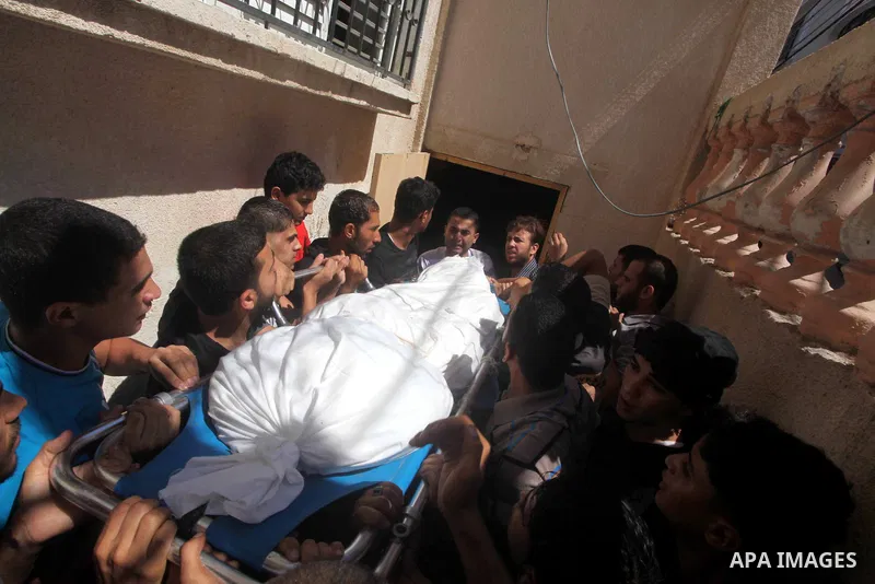Palestinians carry the body of Palestinian security official Ashraf Saleh during his funeral in Rafah in the southern Gaza Strip September 20, 2012. Israel killed two Palestinian security officials, one of them Saleh, in...