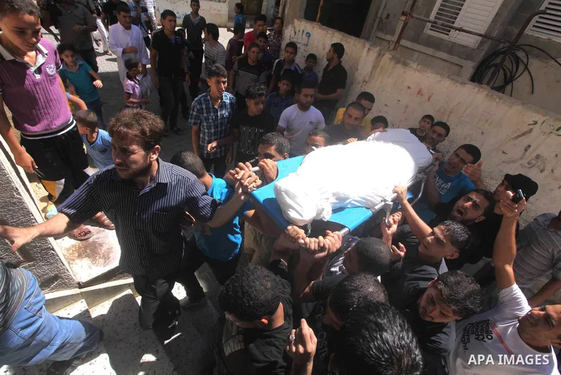 Palestinians carry the body of Palestinian security official Ashraf Saleh during his funeral in Rafah in the southern Gaza Strip September 20, 2012. Israel killed two Palestinian security officials, one of them Saleh, in...