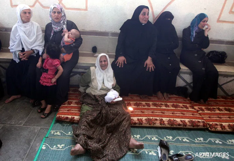Relatives of Palestinian security official Ashraf Saleh mourn during his funeral in Rafah in the southern Gaza Strip September 20, 2012. Israel killed two Palestinian security officials, one of them Saleh, in the Hamas-r...