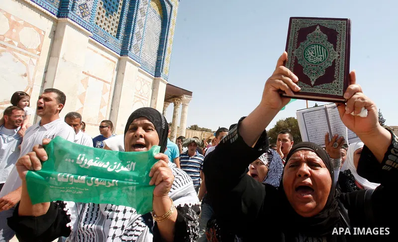 Palestinians shout slogans during a protest against an anti-Islam movie made in the U.S. and French cartoons said to insult the Prophet Muhammad in Jerusalem's Old City, Sept. 21, 2012. Photo by Mahfouz Abu Turk