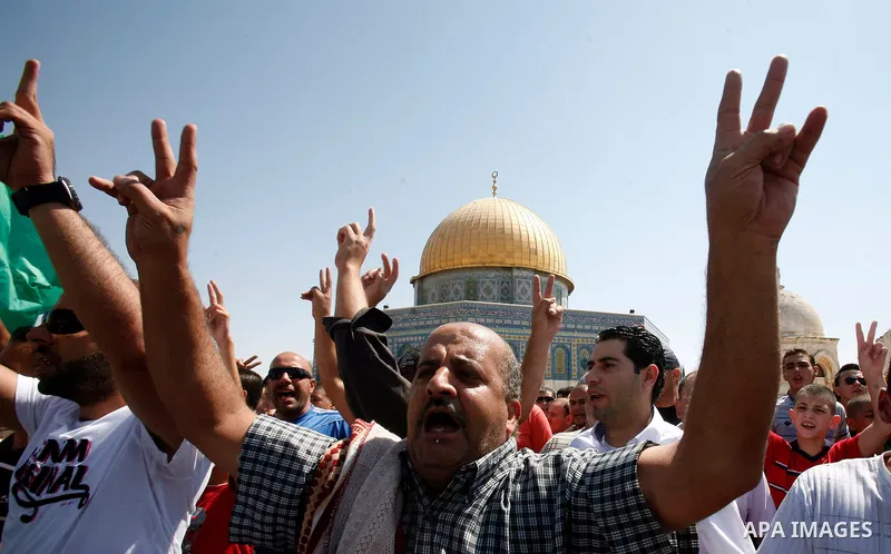 Palestinians shout slogans during a protest against an anti-Islam movie made in the U.S. and French cartoons said to insult the Prophet Muhammad in Jerusalem's Old City, Sept. 21, 2012. Photo by Mahfouz Abu Turk