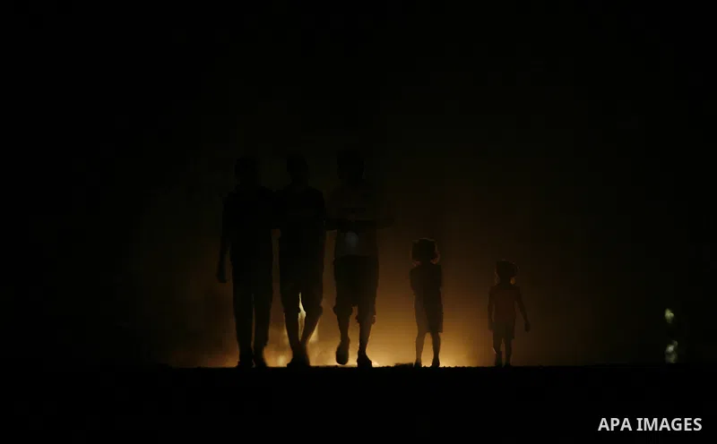 Palestinians walk in the streets of in Rafah in the southern Gaza Strip on Sep. 21, 2012. Gaza Strip is experiencing a major electricity crisis because of a shortage of fuel for the power plant. Photo by Eyad Al Baba