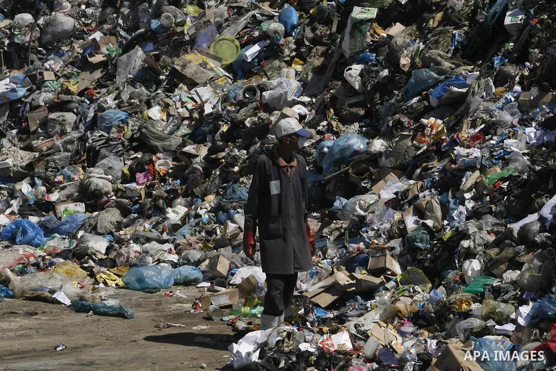 Palestinians collect rubbish to production compost in station in Rafah in the southern Gaza Strip, on Sep. 23, 2012 Some Palestinians, driven by poverty exacerbated by the Israeli blockade and lack of employment opportun...