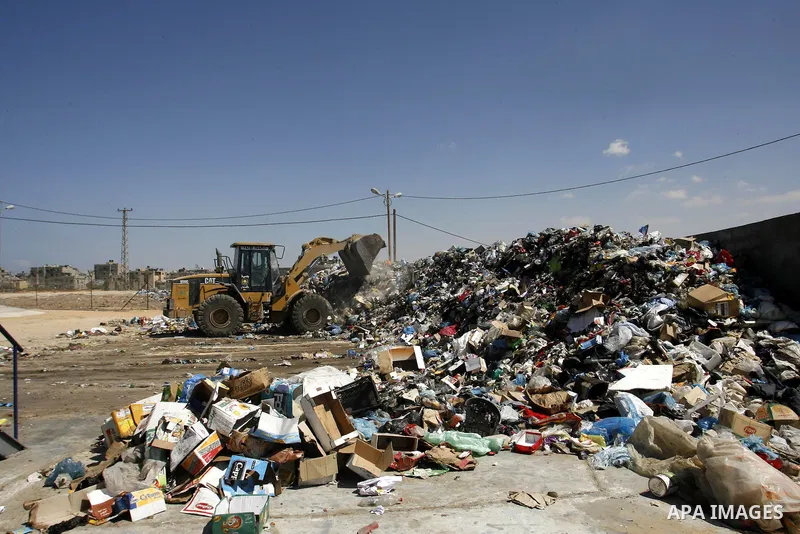 Palestinians collect rubbish to production compost in station in Rafah in the southern Gaza Strip, on Sep. 23, 2012 Some Palestinians, driven by poverty exacerbated by the Israeli blockade and lack of employment opportun...
